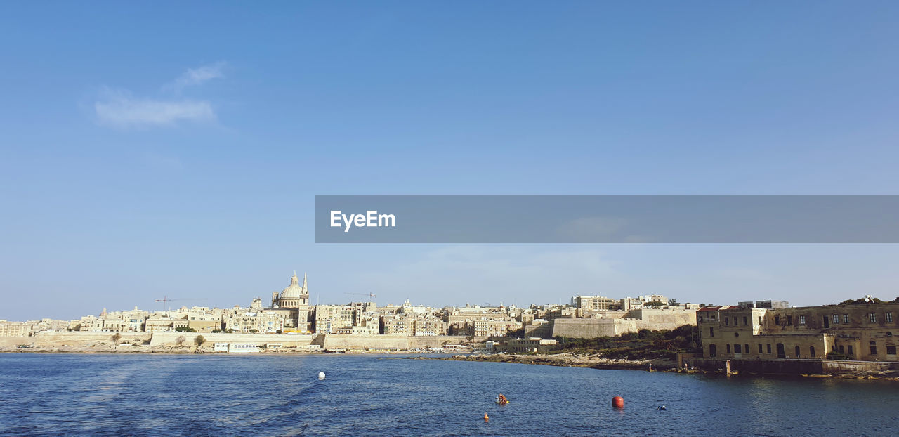 VIEW OF BUILDINGS BY SEA