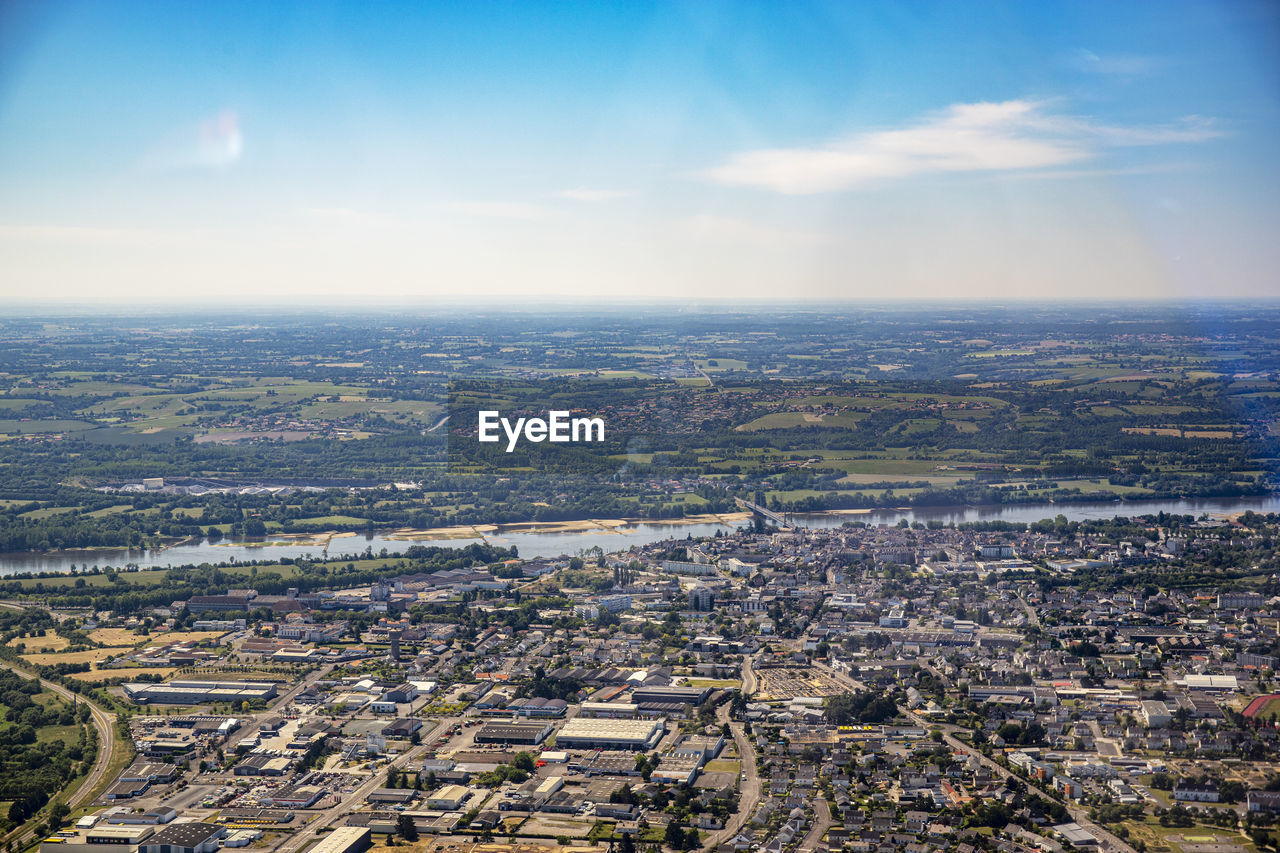 AERIAL VIEW OF CITY AGAINST SKY