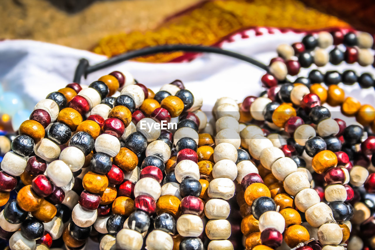 Close-up of multi colored jewelry for sale