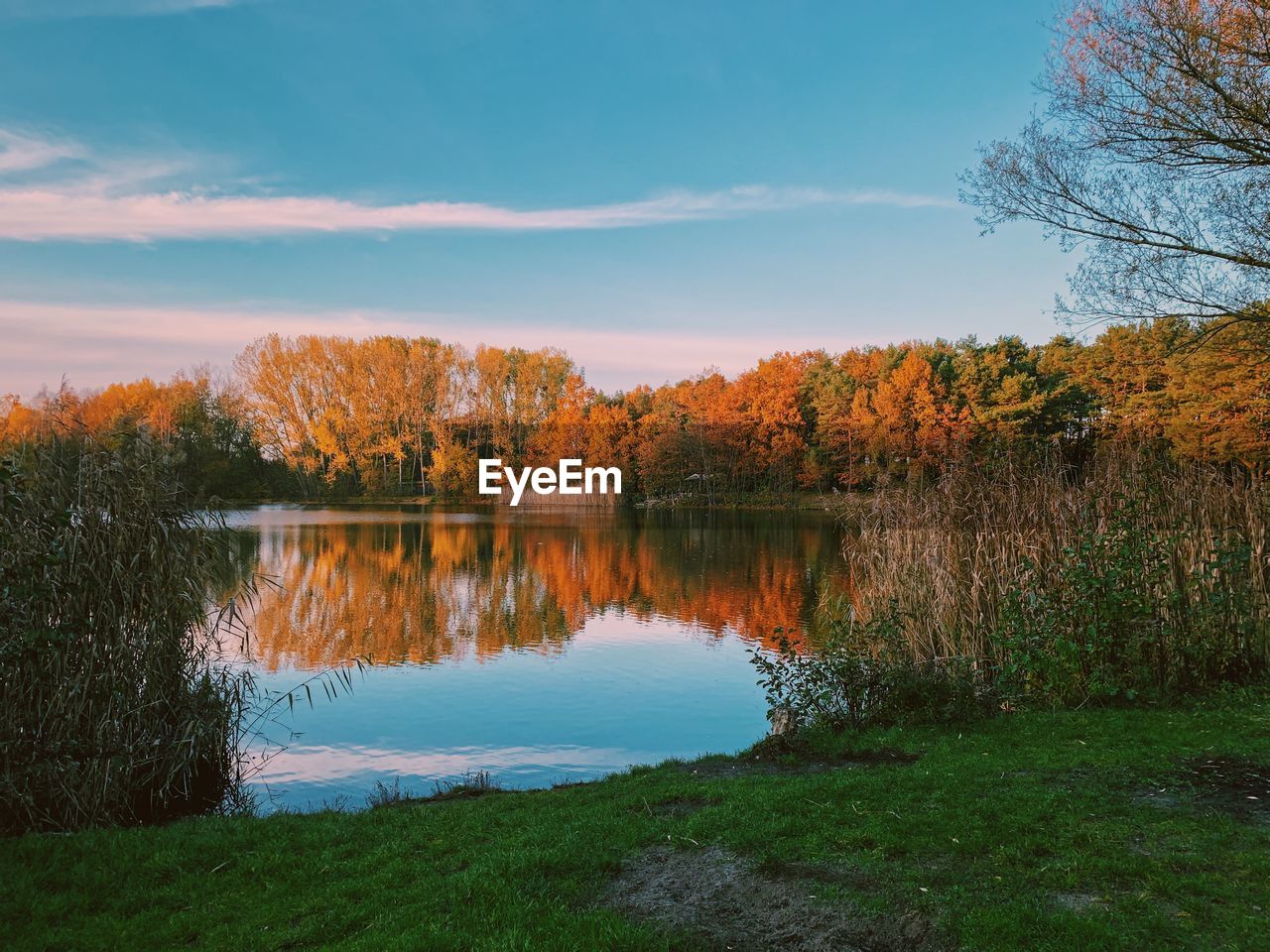 Scenic view of lake against sky during autumn