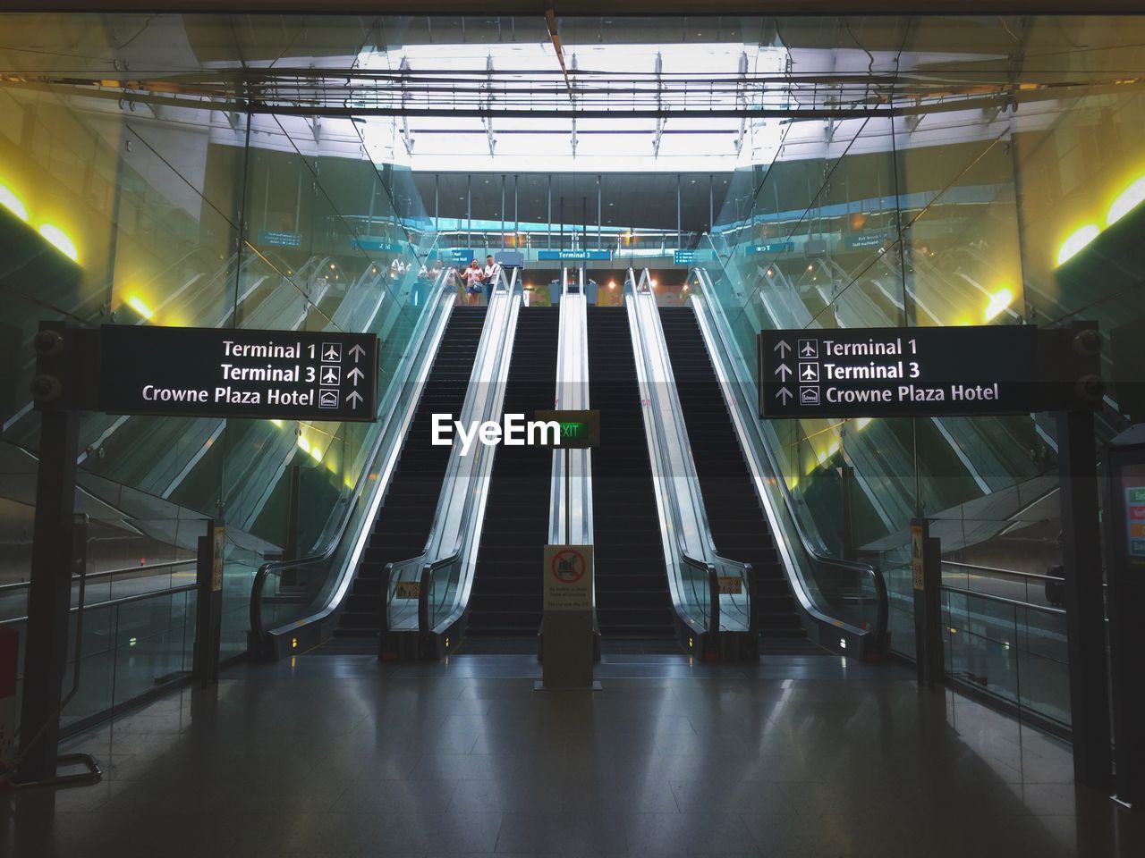 ILLUMINATED TEXT ON WALL IN UNDERGROUND WALKWAY