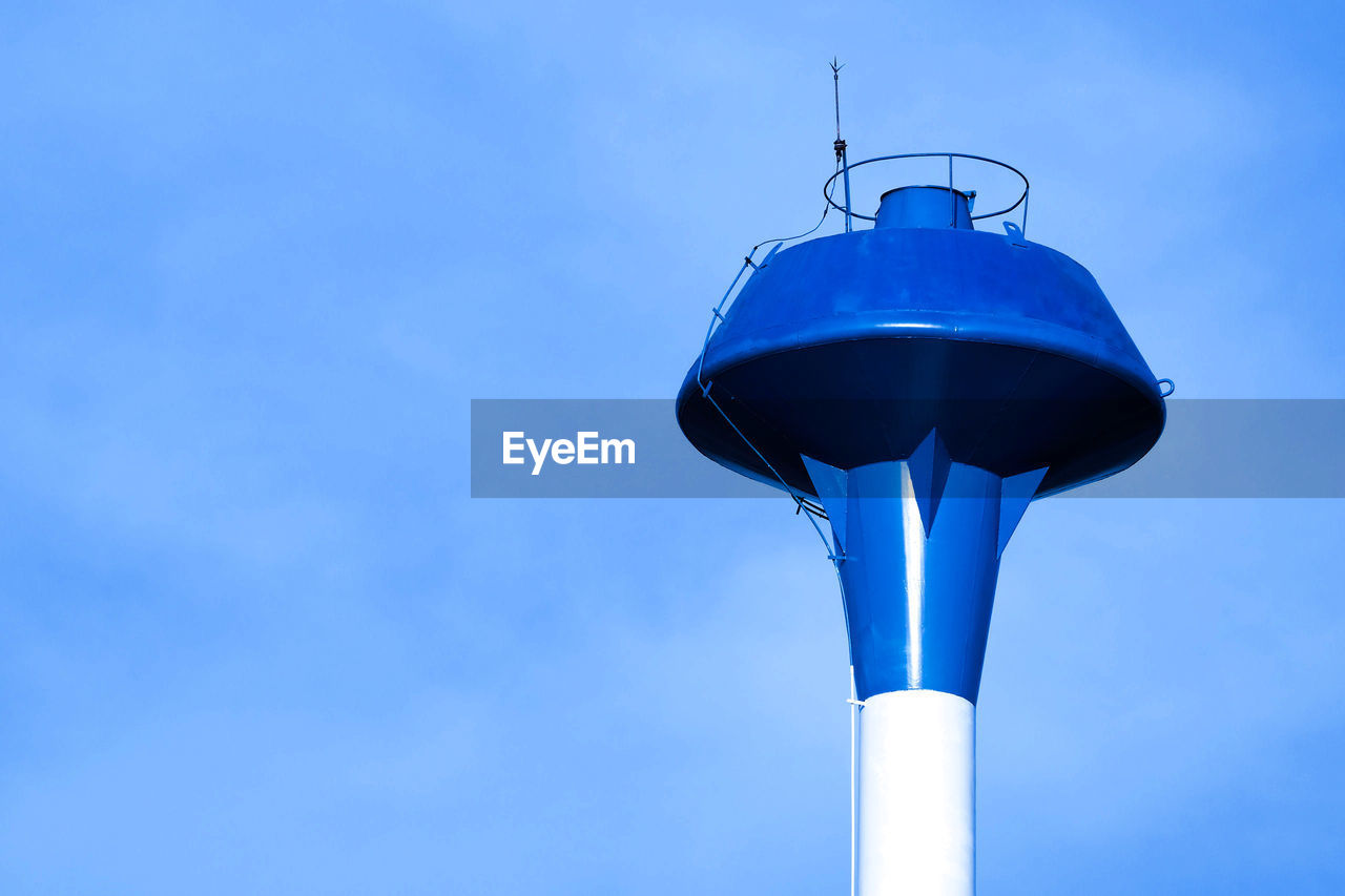 LOW ANGLE VIEW OF LAMP AGAINST BLUE SKY