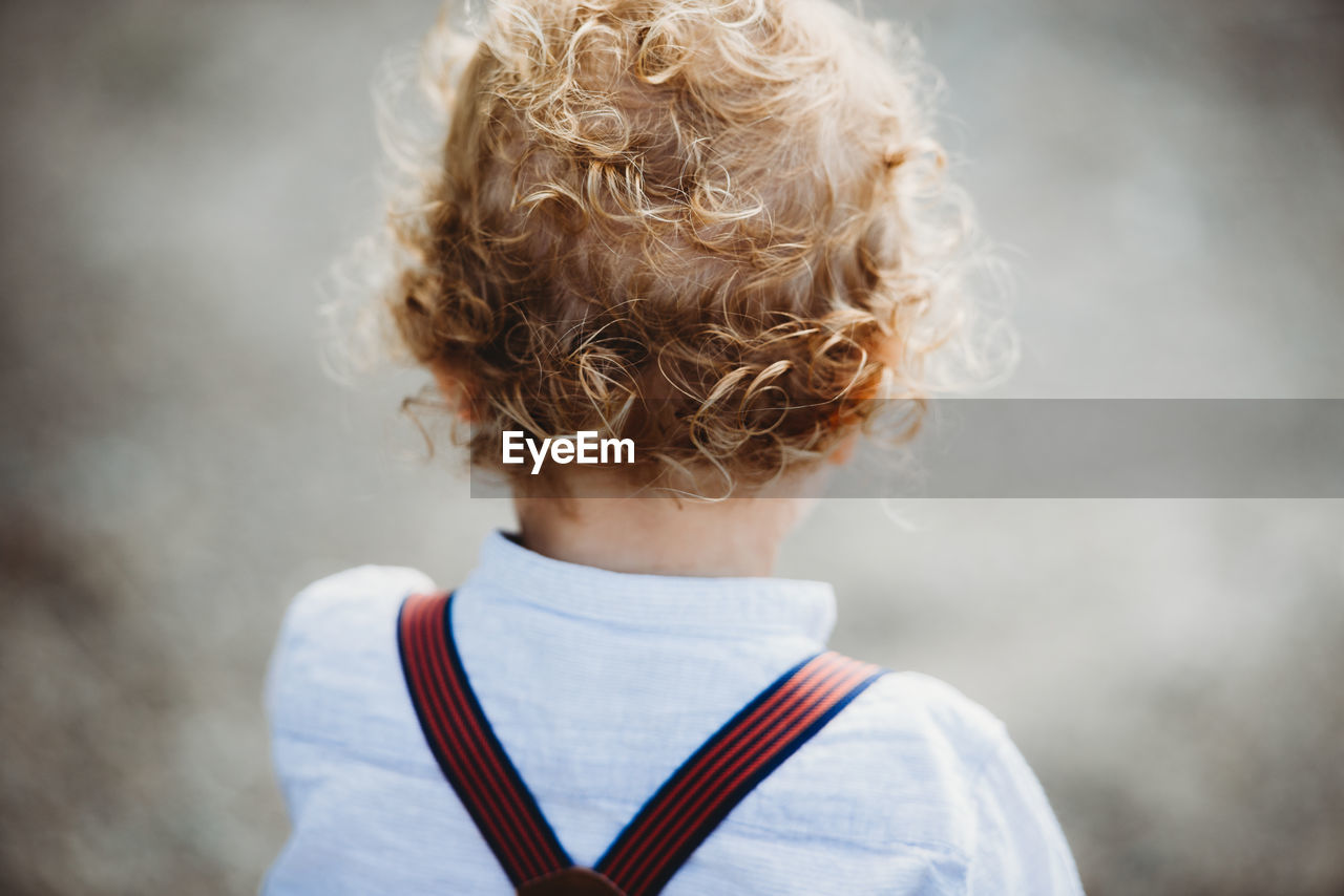 Back view of a young child with lots of blonde curls