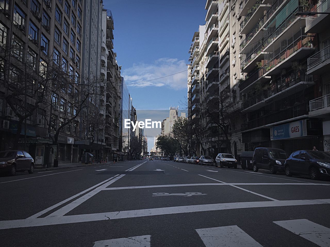 VIEW OF CITY STREET AGAINST SKY