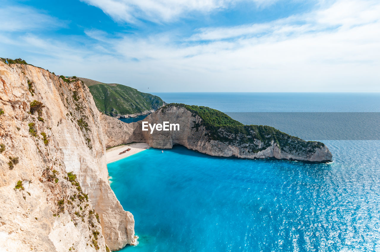 SCENIC VIEW OF SEA AND ROCK FORMATION AGAINST SKY