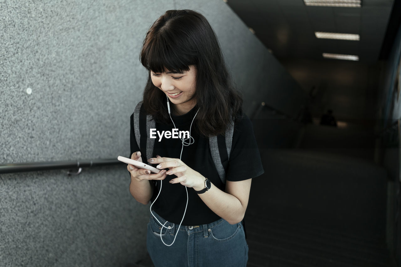 Young woman using mobile phone