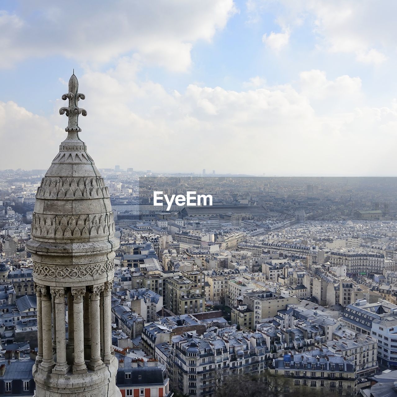 Aerial view of city buildings against sky