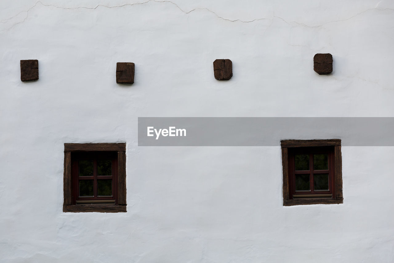 Windows of a traditional house in spania dolina village.