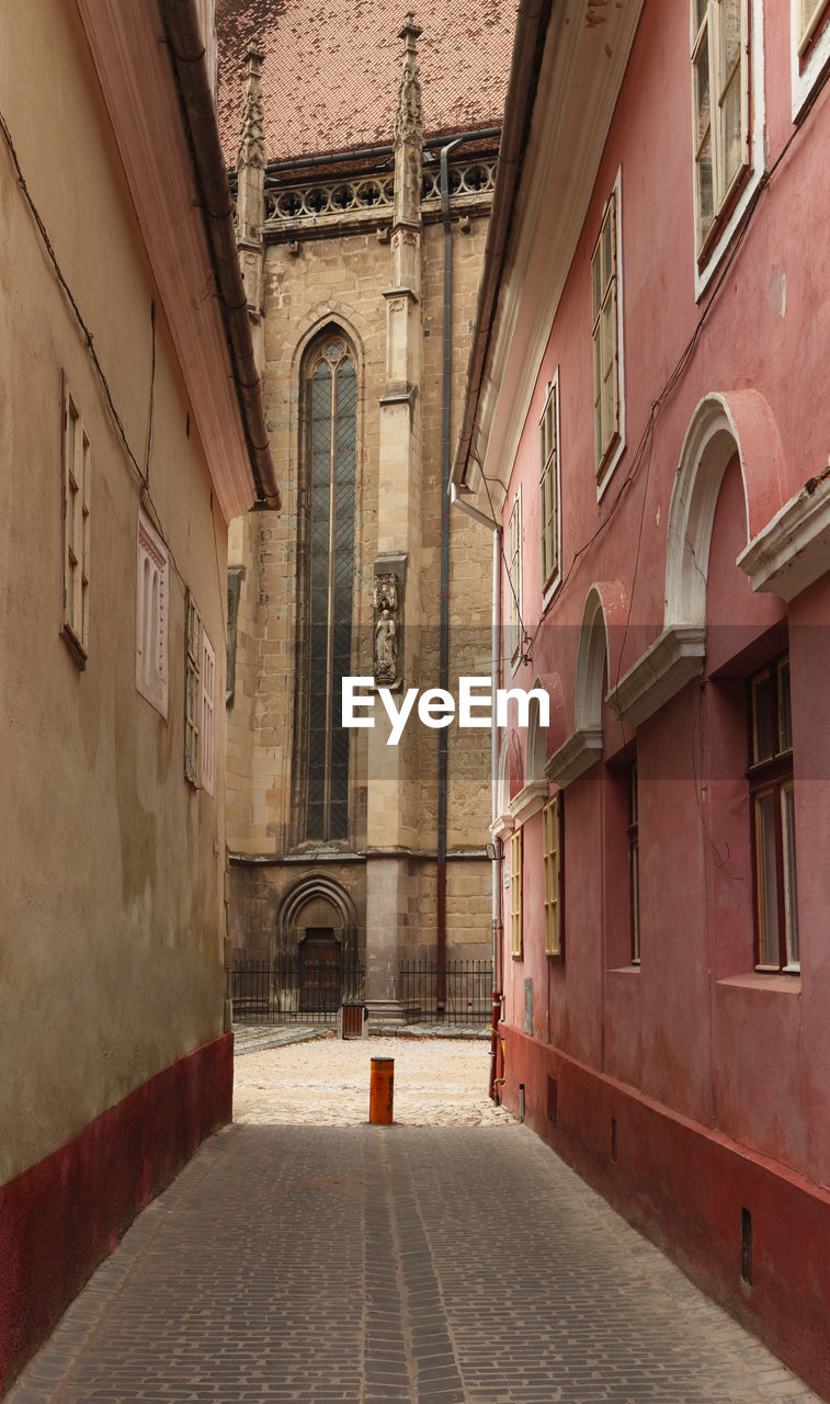 FOOTPATH AMIDST BUILDINGS IN TOWN