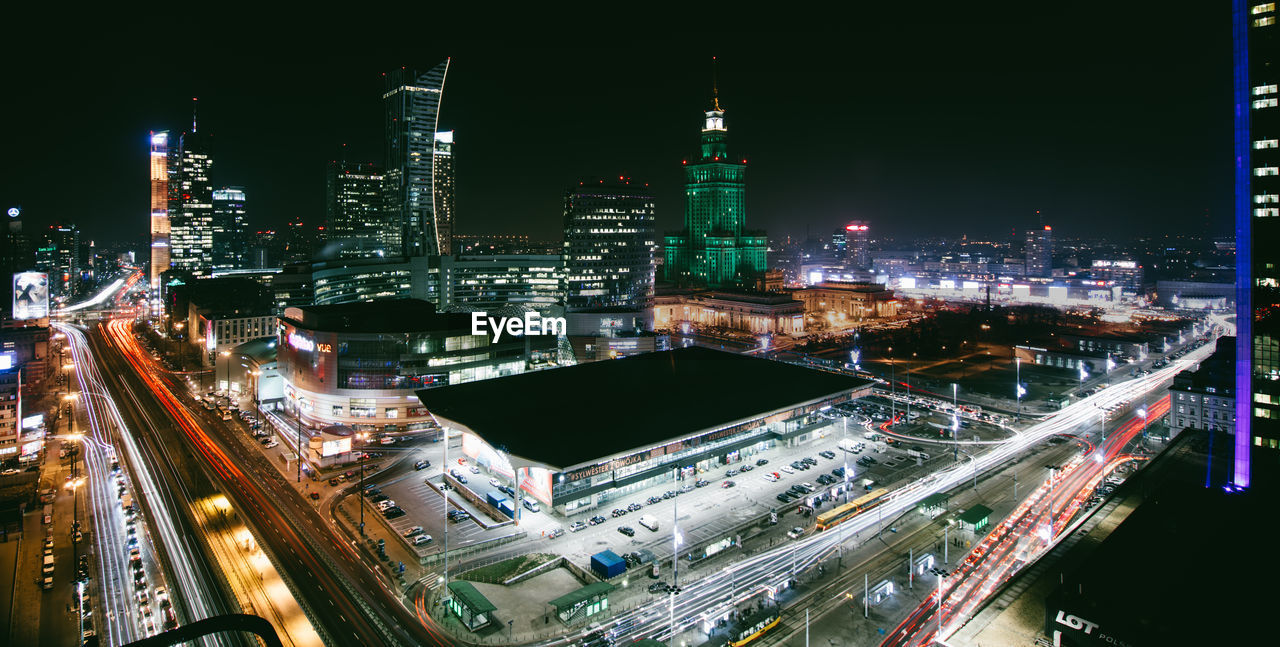 High angle view of city lit up at night