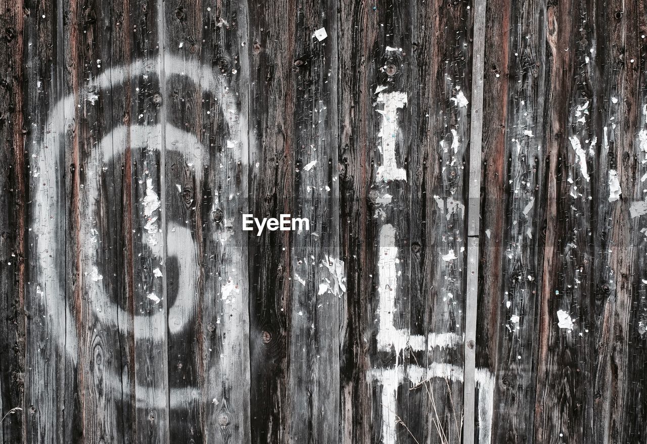 Full frame shot of wooden plank with spray paint