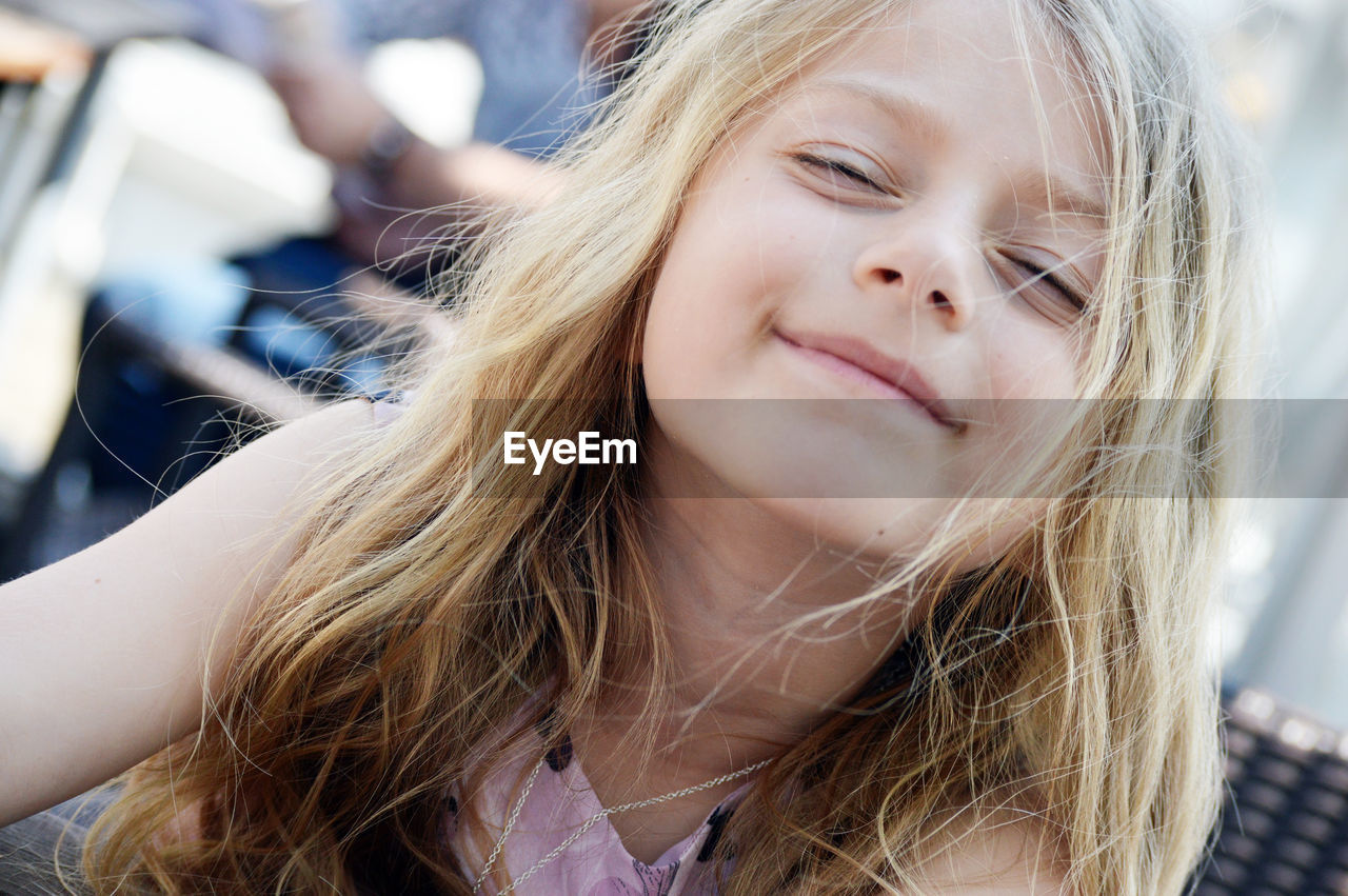 Close-up portrait of smiling girl