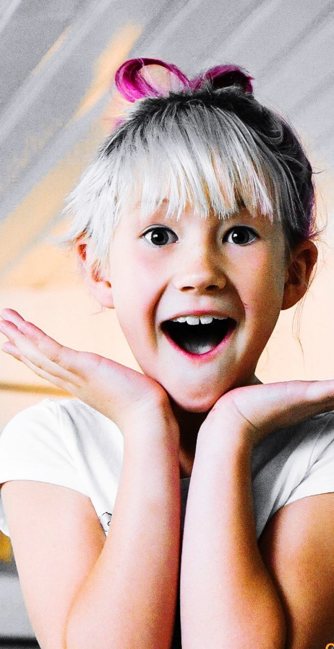 Portrait of cute surprised girl with mouth open standing at home