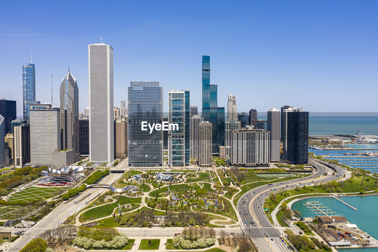 PANORAMIC SHOT OF MODERN BUILDINGS AGAINST SKY