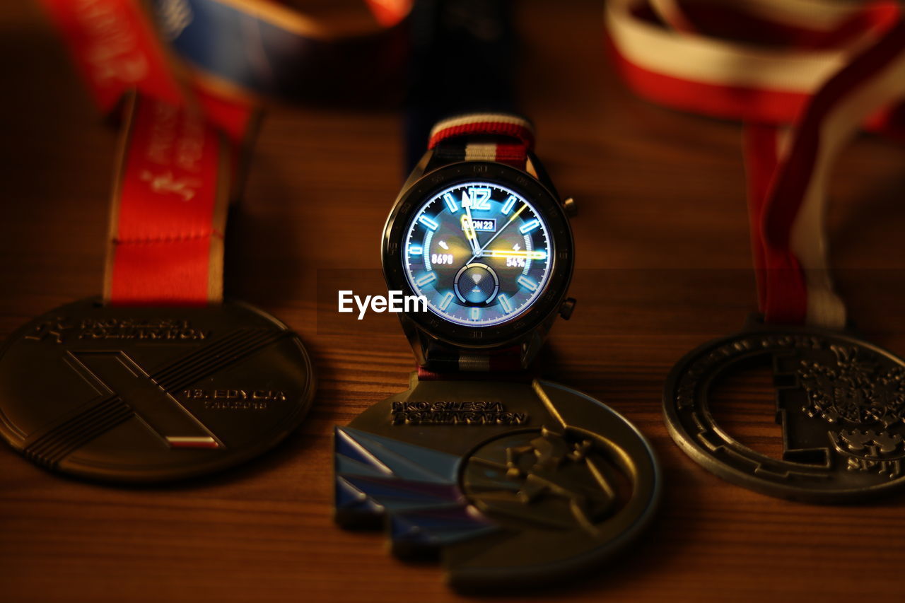 HIGH ANGLE VIEW OF EYEGLASSES ON TABLE AT HOME