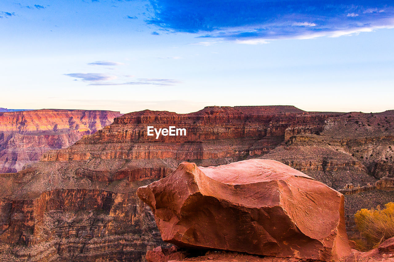 Rock formations on landscape against sky