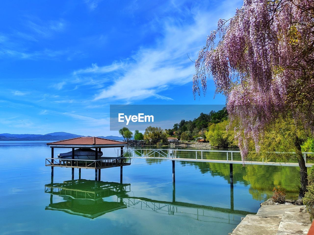 GAZEBO ON LAKE AGAINST SKY