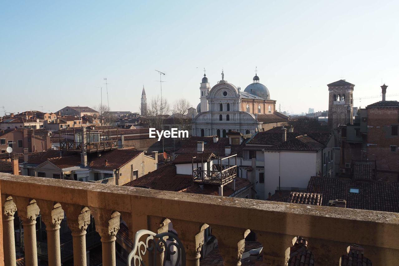 Buildings in city against clear sky in venice italy 