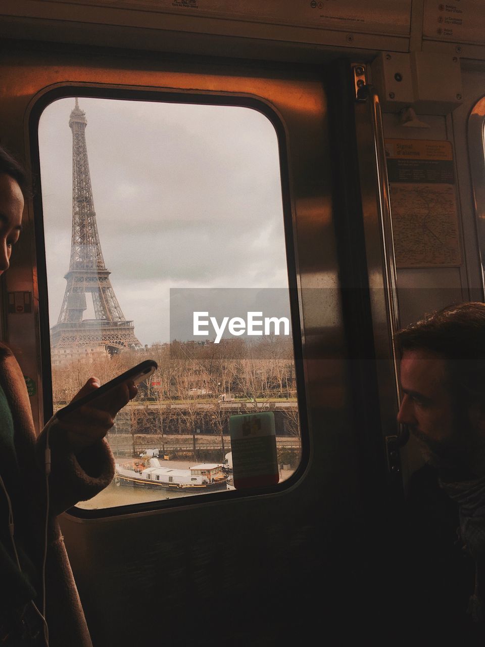 REFLECTION OF TRAIN ON GLASS WINDOW