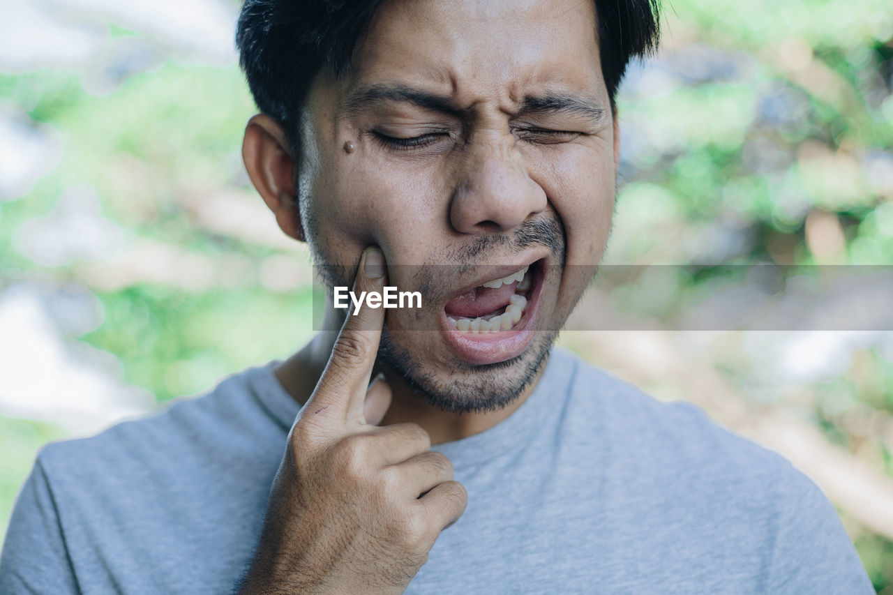 Close-up of man with toothache