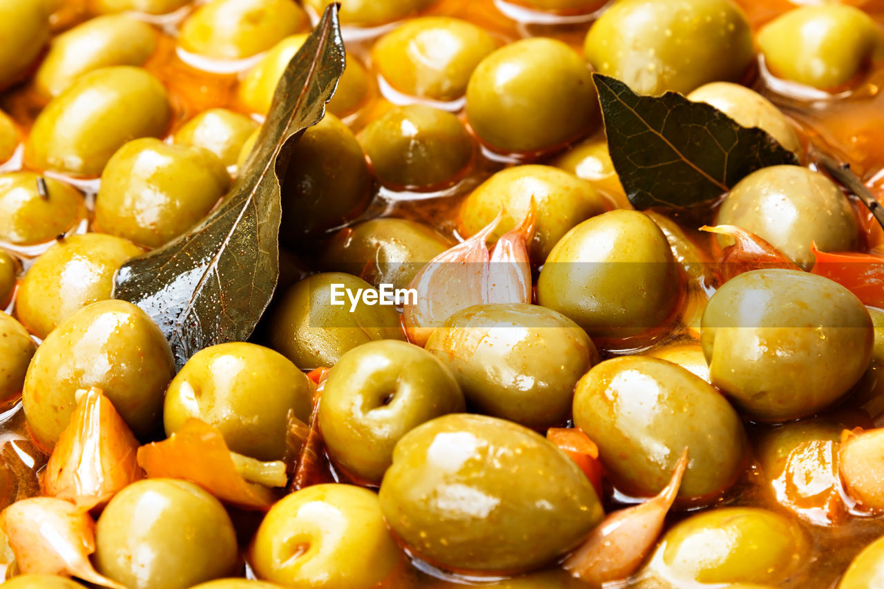 Marinated olives on a traditional craftsman image.