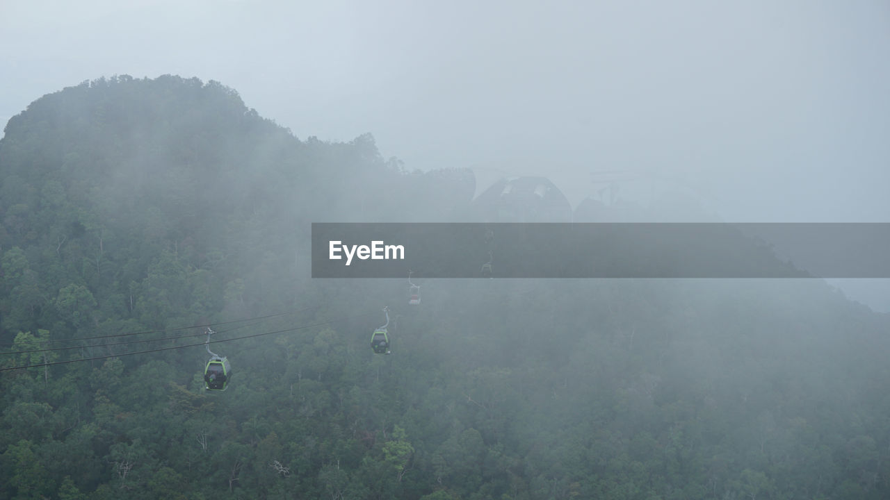 VIEW OF LANDSCAPE AGAINST SKY DURING RAINY SEASON