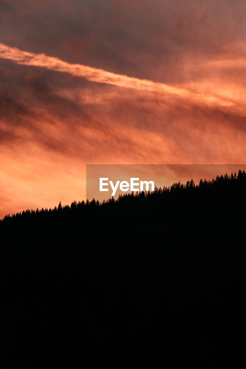 Scenic view of dramatic sky during sunset