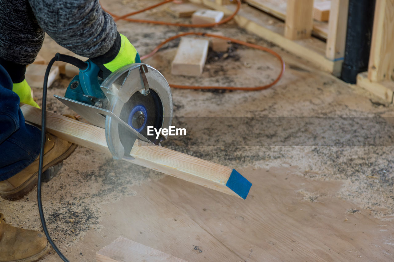 Man working on wood at home