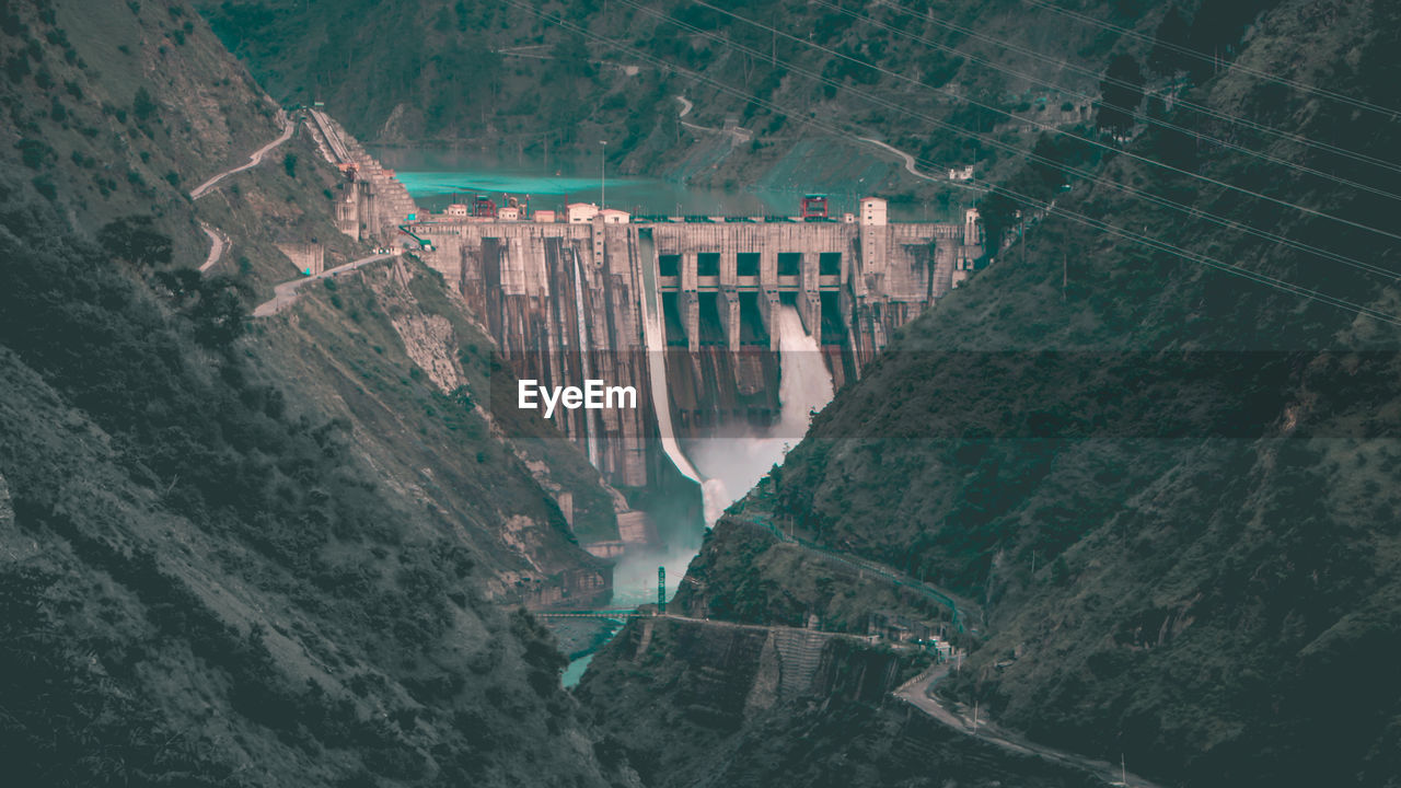 High angle view of dam by mountains