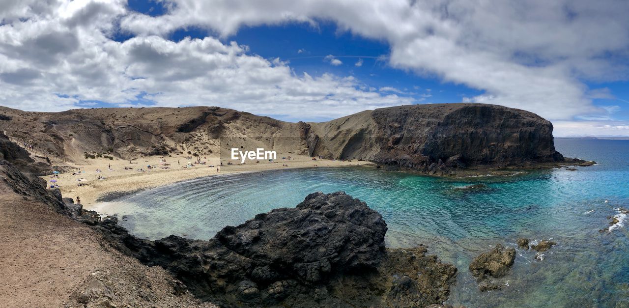 Panoramic view of rock formation in sea against sky papagayo beach 
