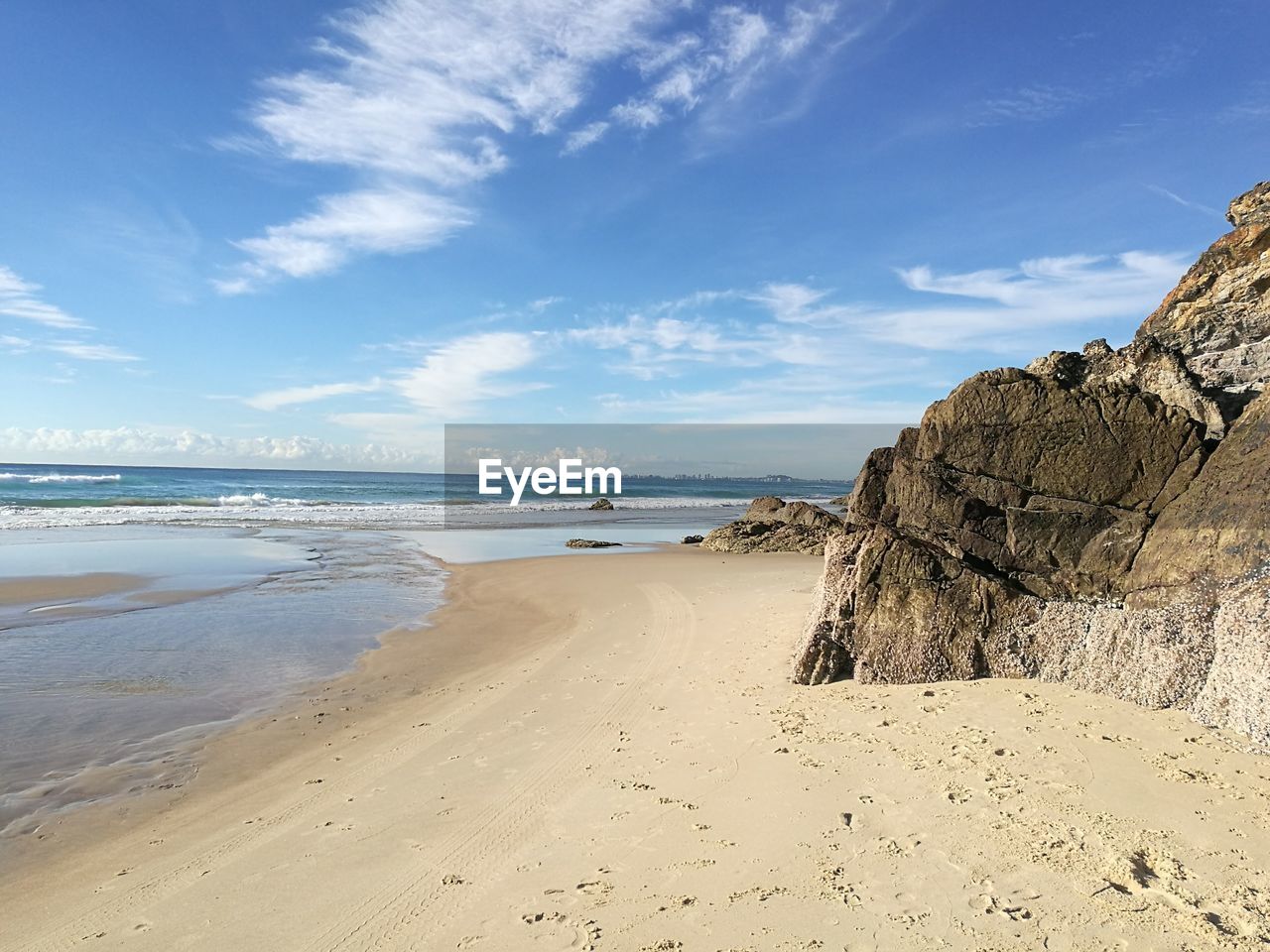 Scenic view of beach against sky