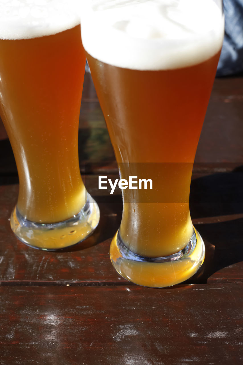 CLOSE-UP OF BEER ON TABLE