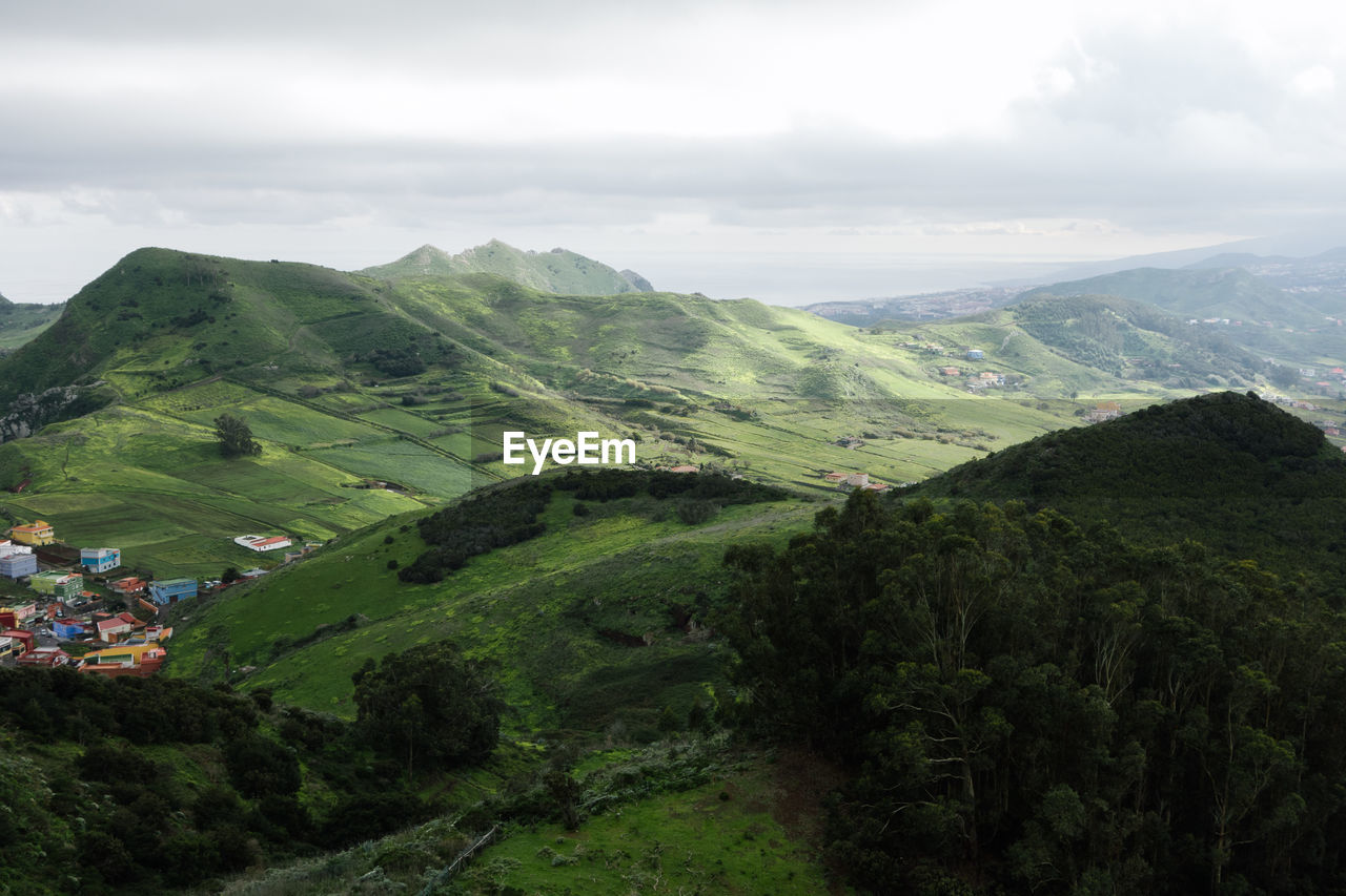 Aerial view of agricultural field against sky