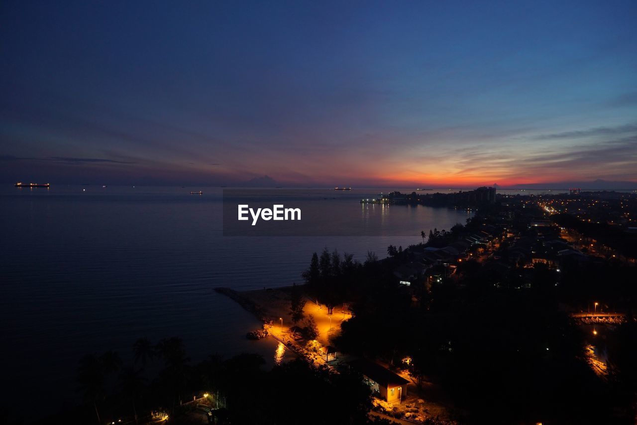 Scenic view of sea against sky at dusk