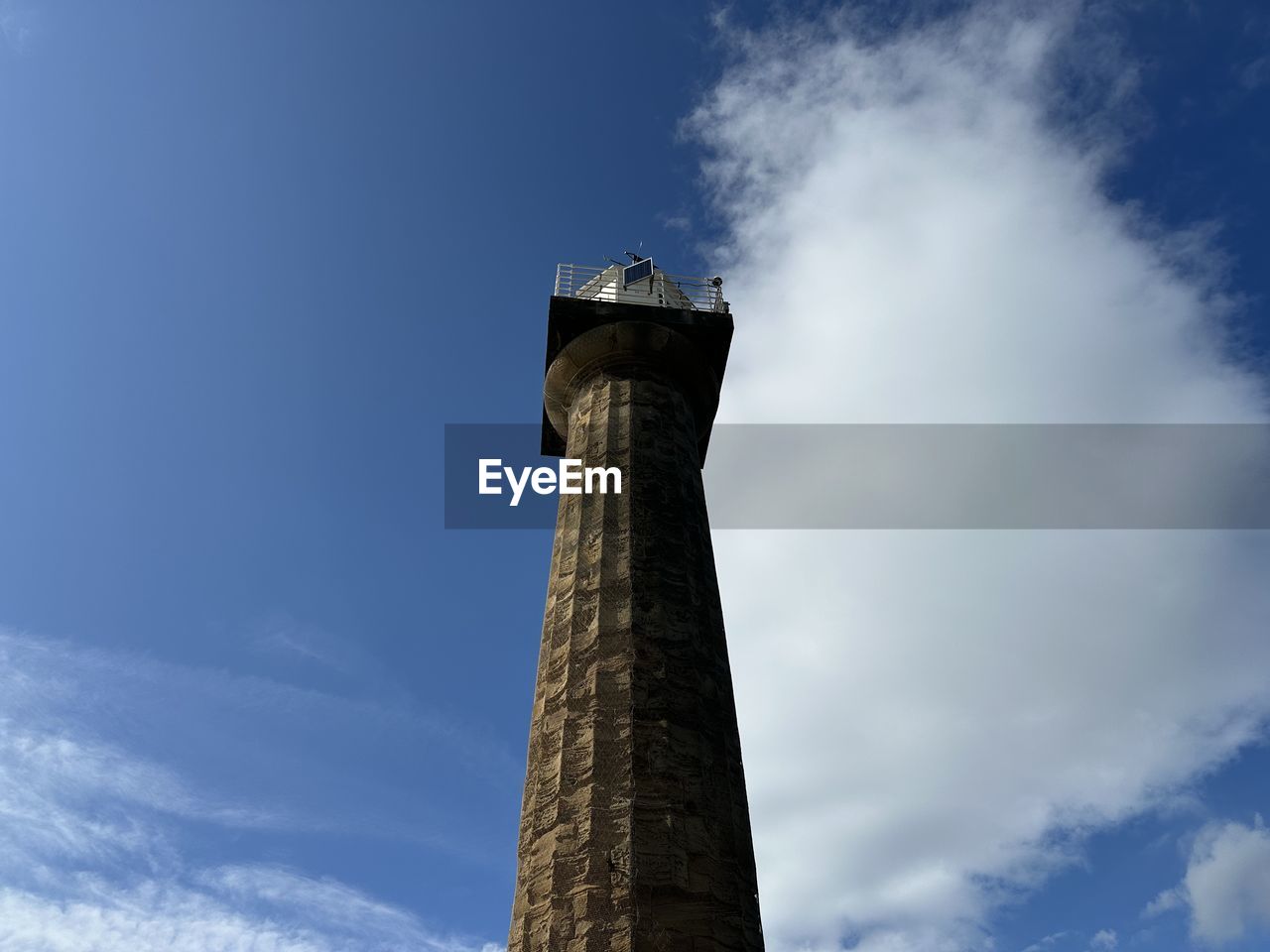 sky, tower, blue, architecture, cloud, built structure, low angle view, smoke stack, nature, factory, building exterior, no people, industry, landmark, day, chimney, outdoors, environmental issues, pollution, environment, air pollution, smoke, history