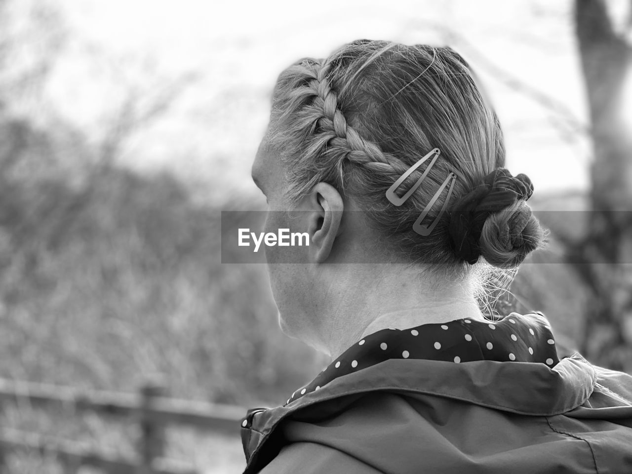 Close-up portrait of a serious young woman looking away