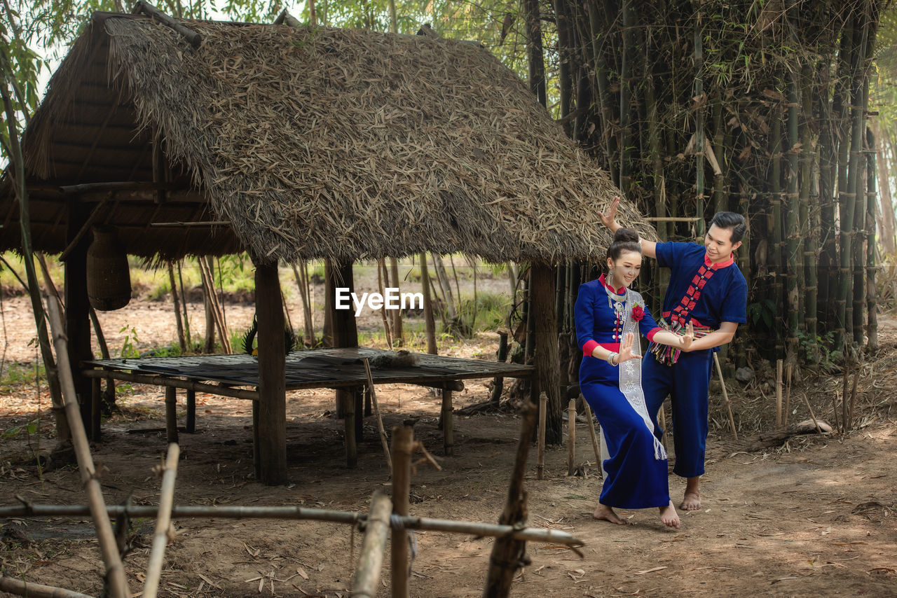 Pre wedding shoot inside garden in thai traditional dress costumes