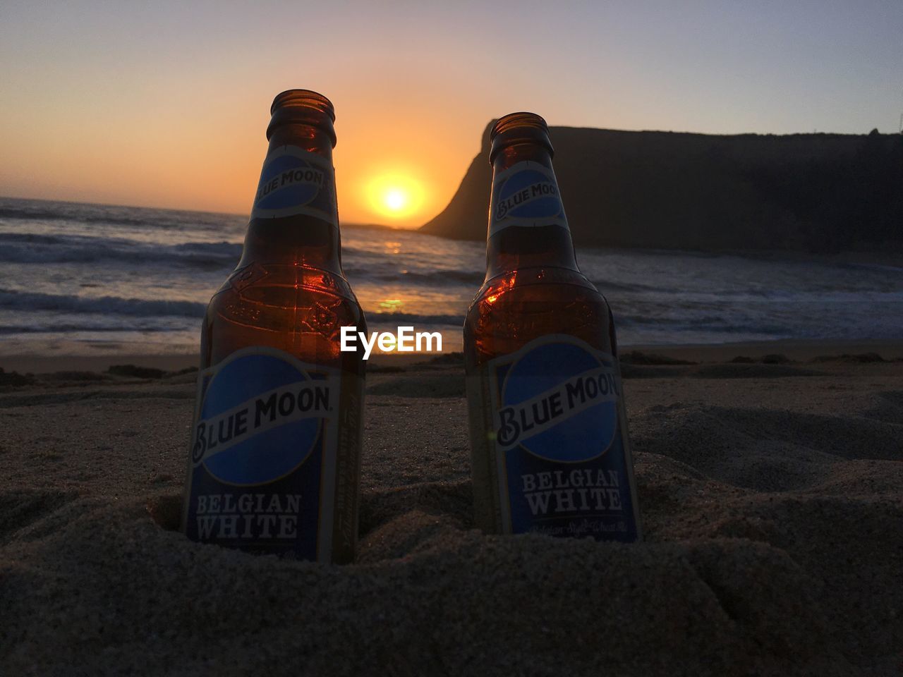 VIEW OF BOTTLE AT BEACH