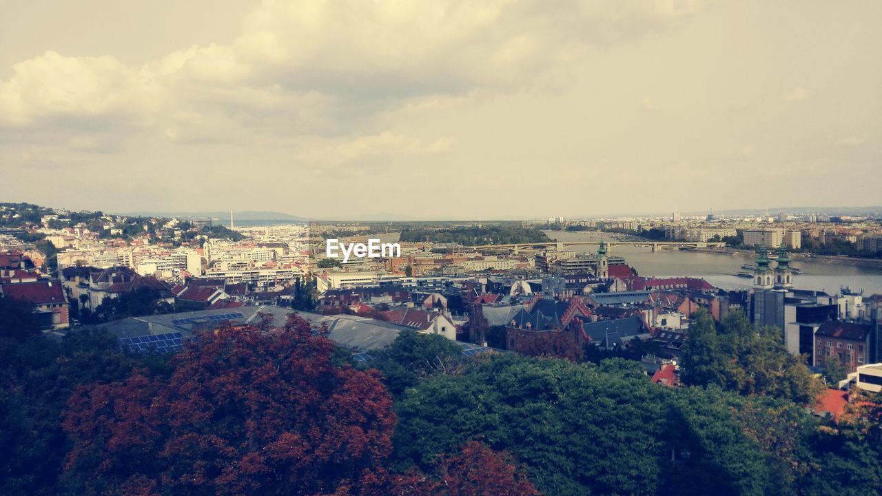 HIGH ANGLE VIEW OF CITY AGAINST SKY