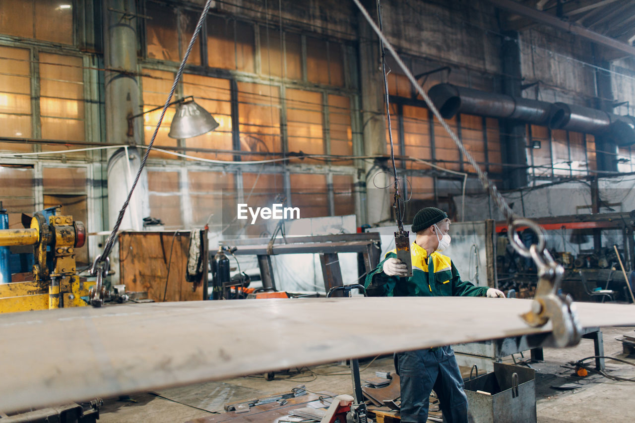 cropped image of man working at workshop