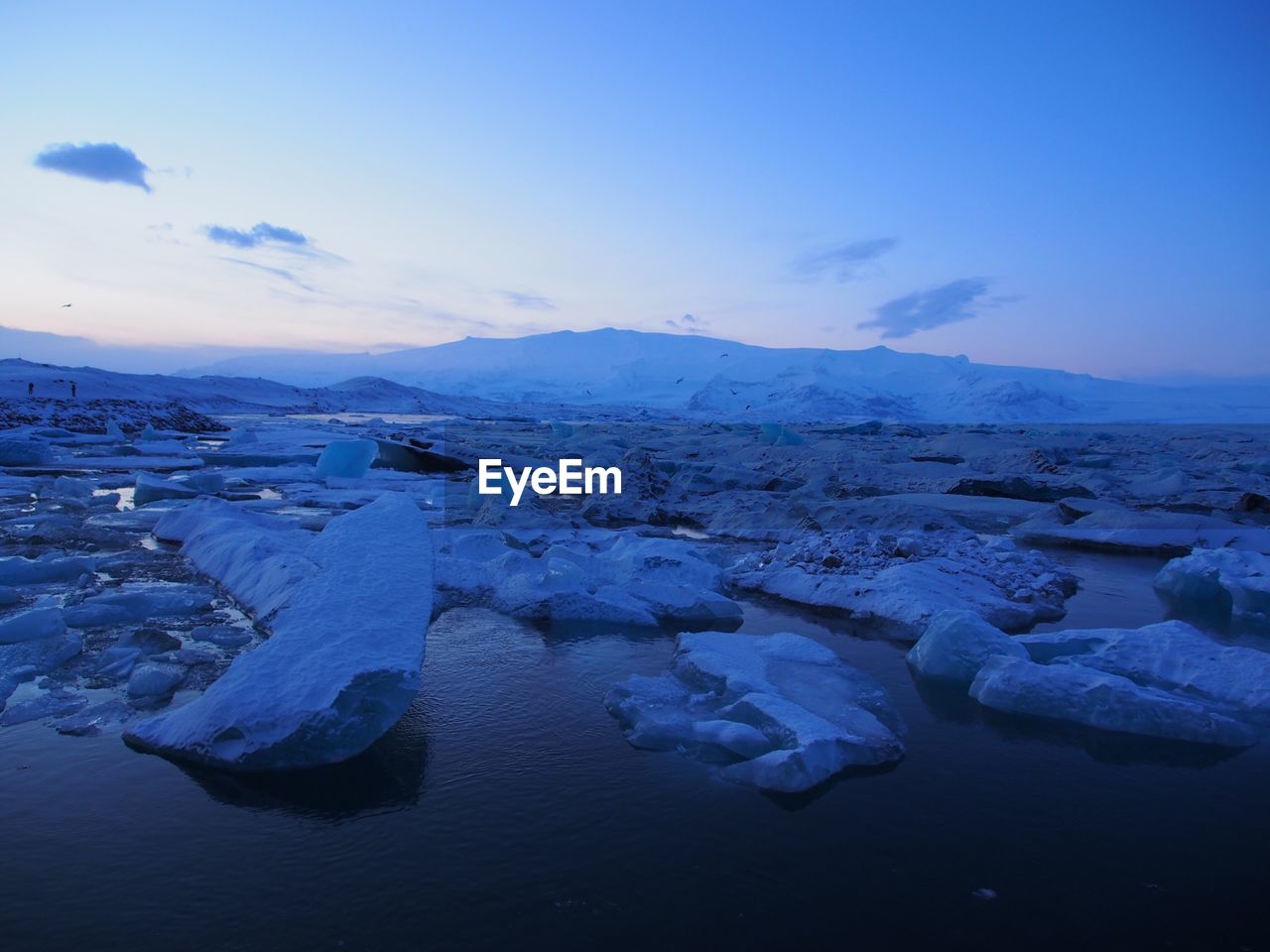 Scenic view of sea against blue sky