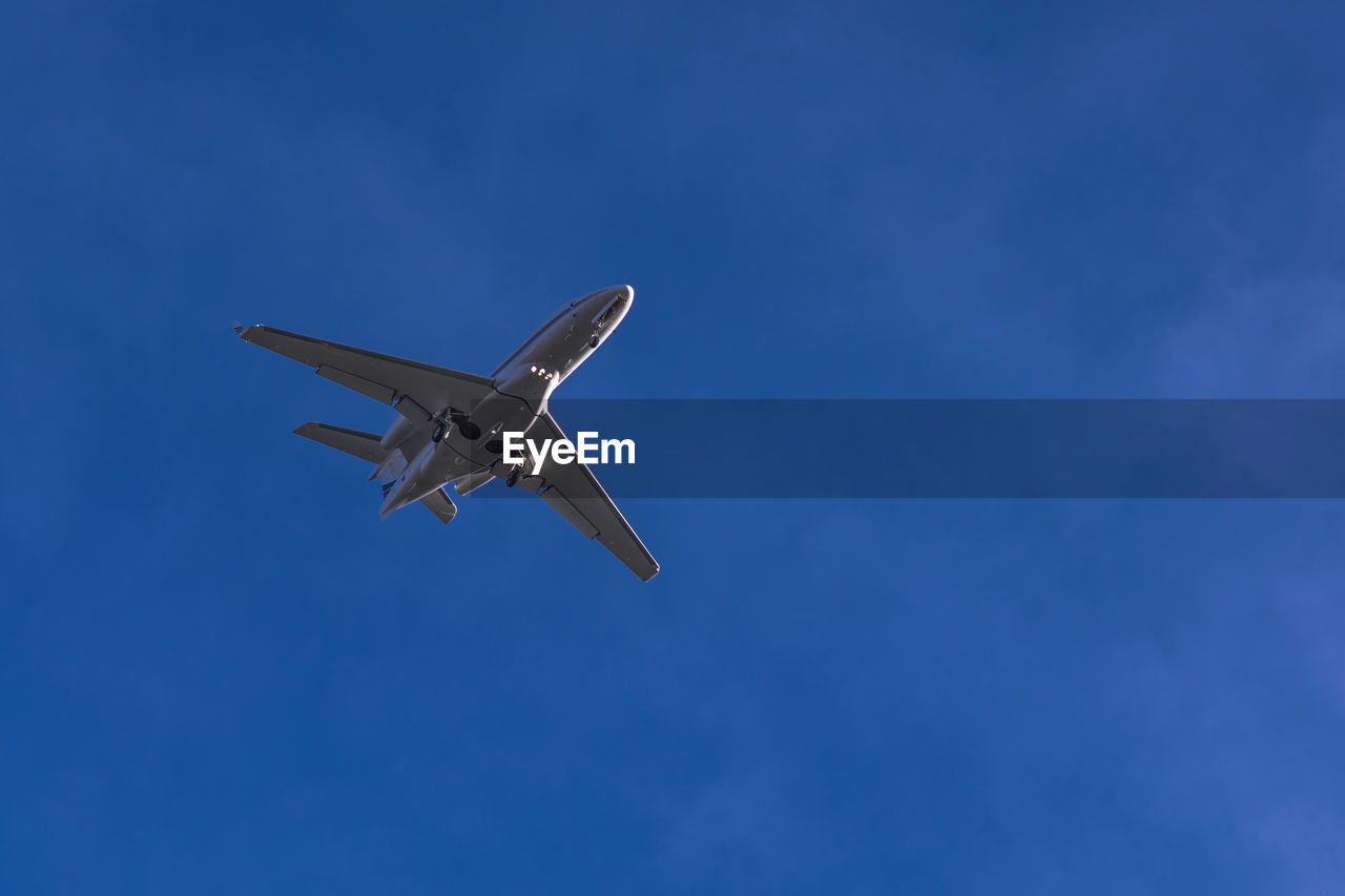 Low angle view of airplane flying in sky