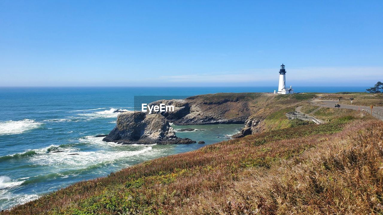 Light house sunny day ocean waves coast of oregon