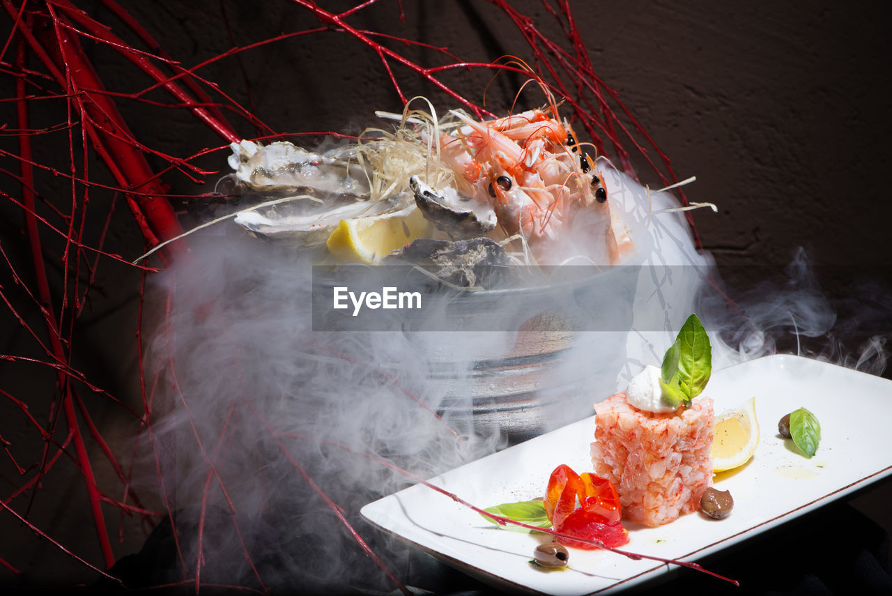 Seafood platter serve with liquid nitrogen special effect