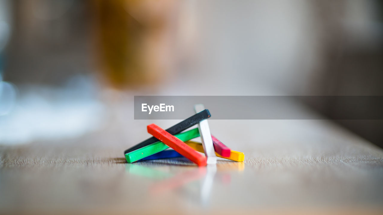 Close-up of colorful crayons on table