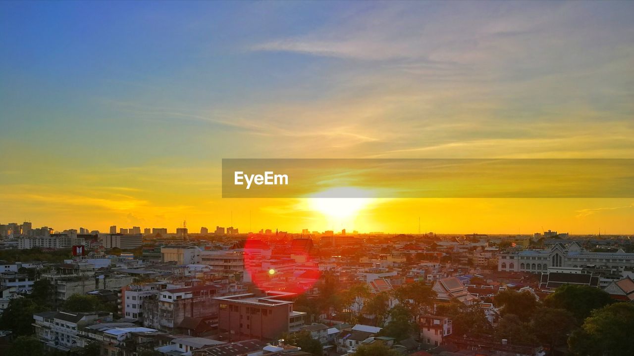 Cityscape against sky during sunset