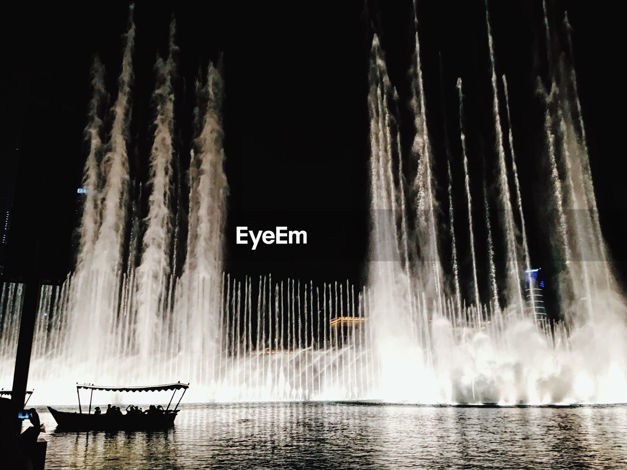 Panoramic view of boat in water at night