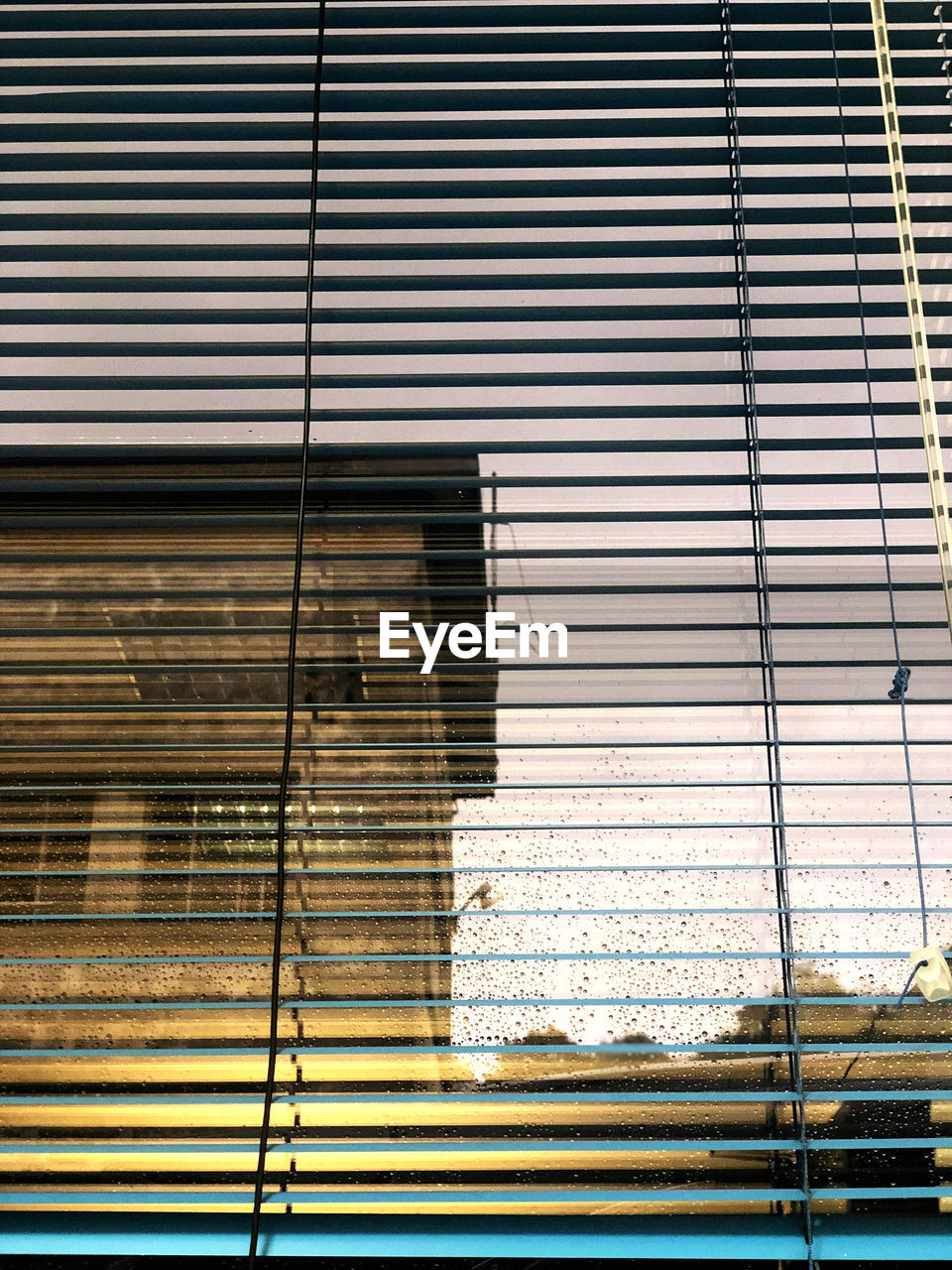 LOW ANGLE VIEW OF BUILDING SEEN THROUGH WINDOW