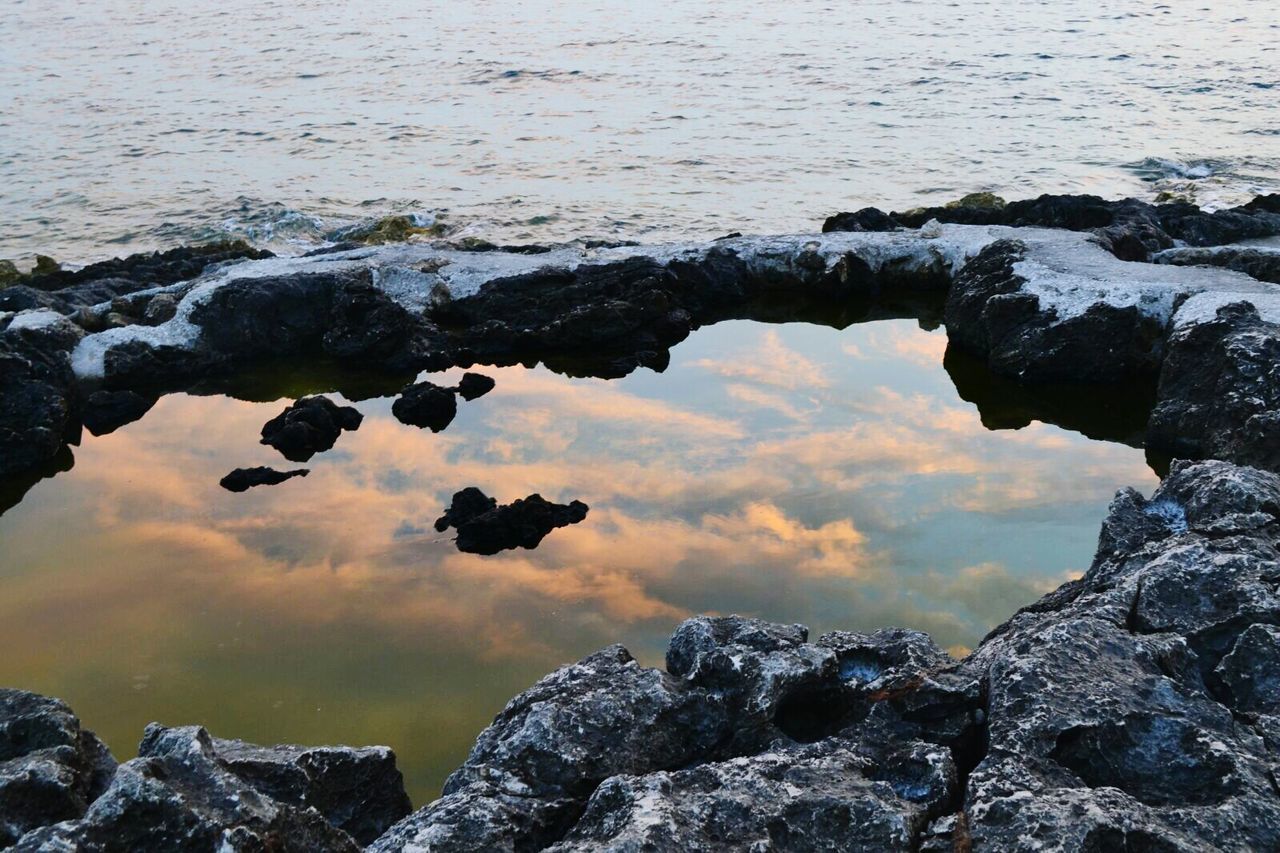 Scenic view of lake against sky during sunset