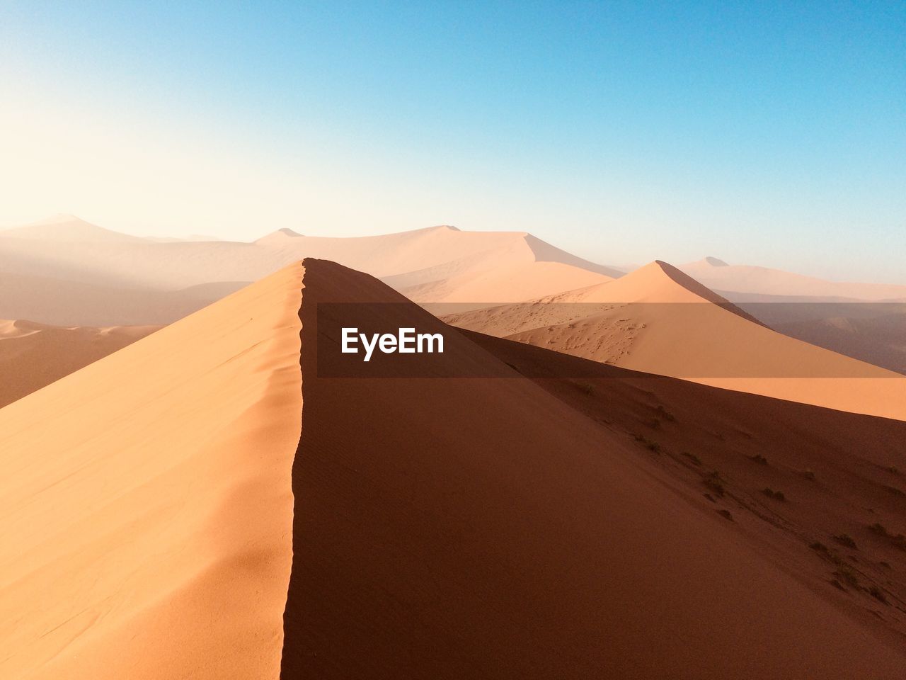 Scenic view of desert against clear sky